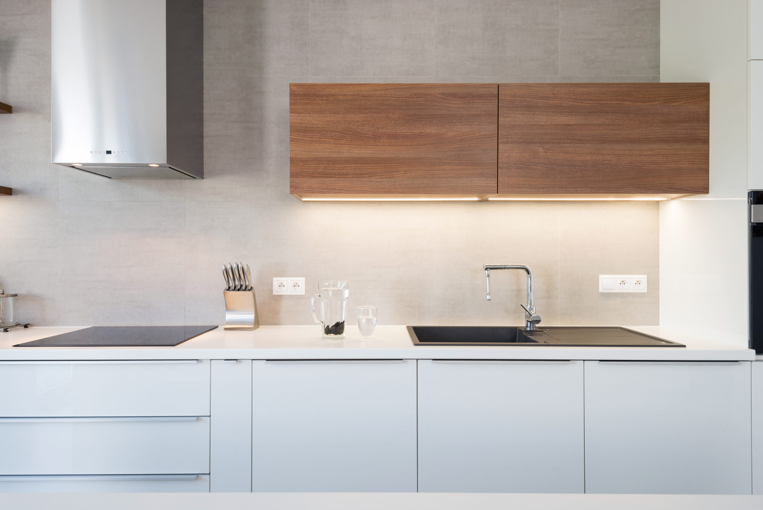 Kitchen showing off trendy integrated lighting in the cabinets.